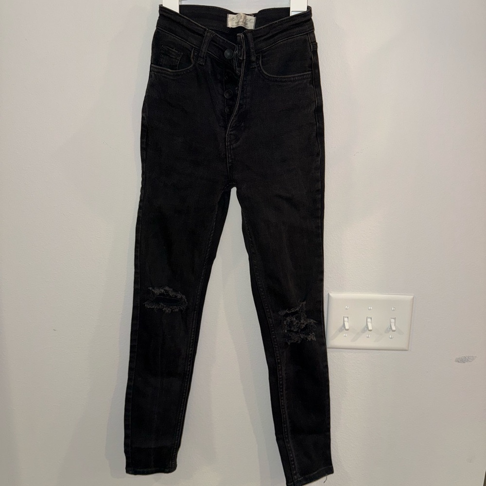 Free People black skinny jeans with tears in knees, size 24